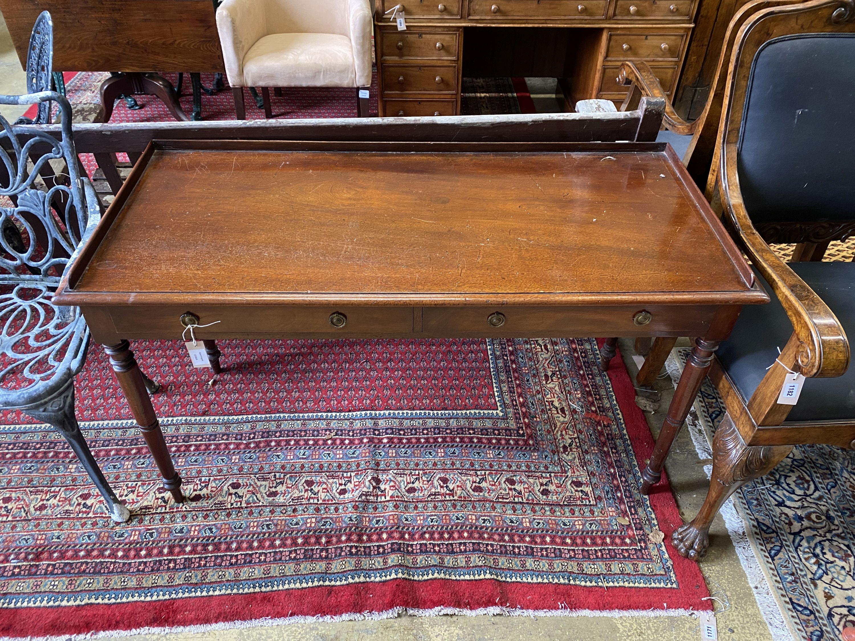 A Victorian mahogany two drawer washstand, with three quarter galleried top, width 135cm, depth 58cm, height 76cm